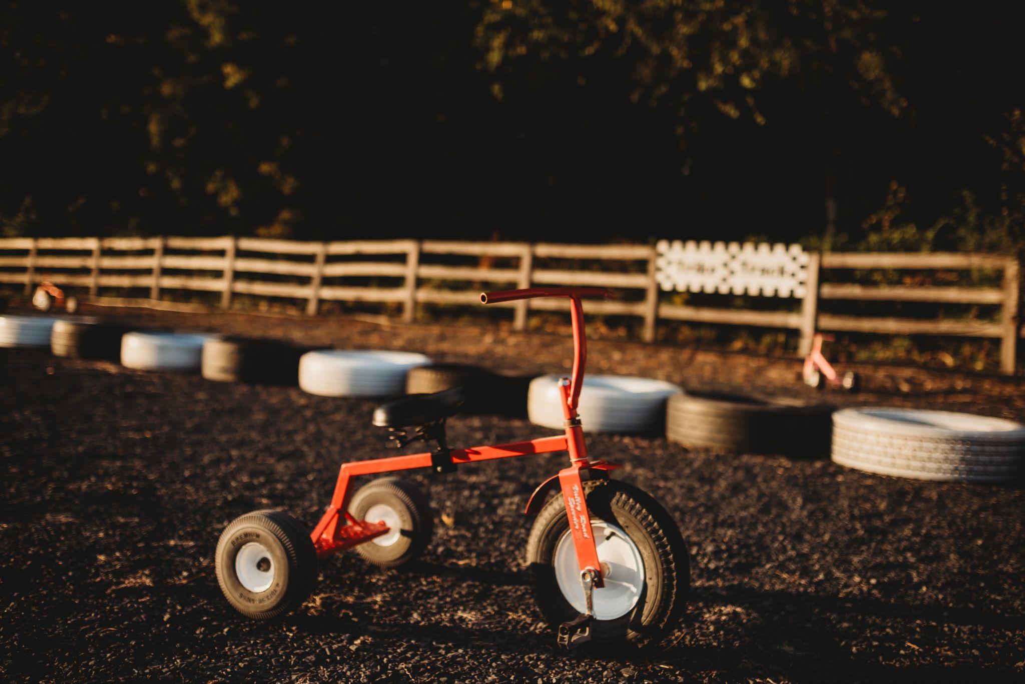 A red tricycle on the trike track
